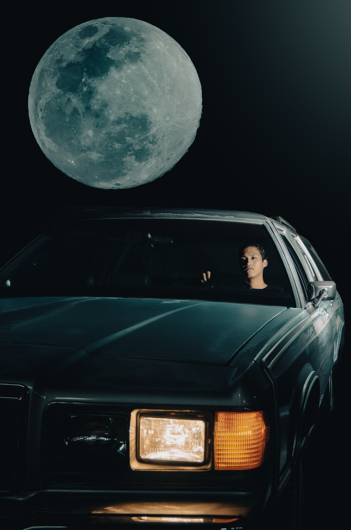 TAKAHASHI LAB — a person seated in a car at night, one headlight lit, with a large moon in the dark sky above